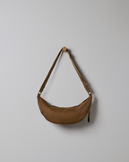 Vuori Arden Crescent Sling | Bourbon